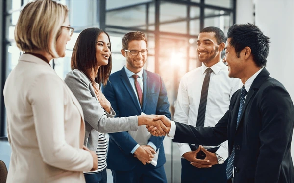 People in suits shaking hands